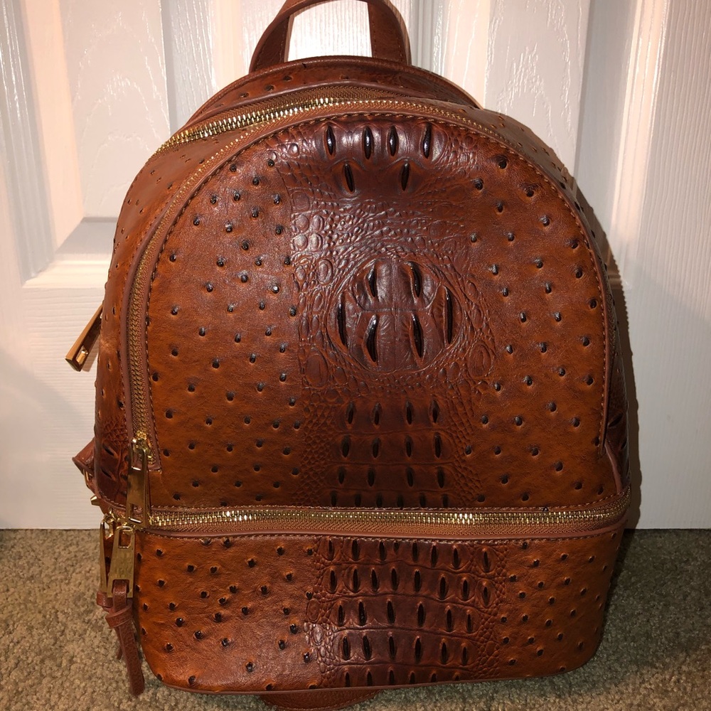 Croc embossed brown backpack.